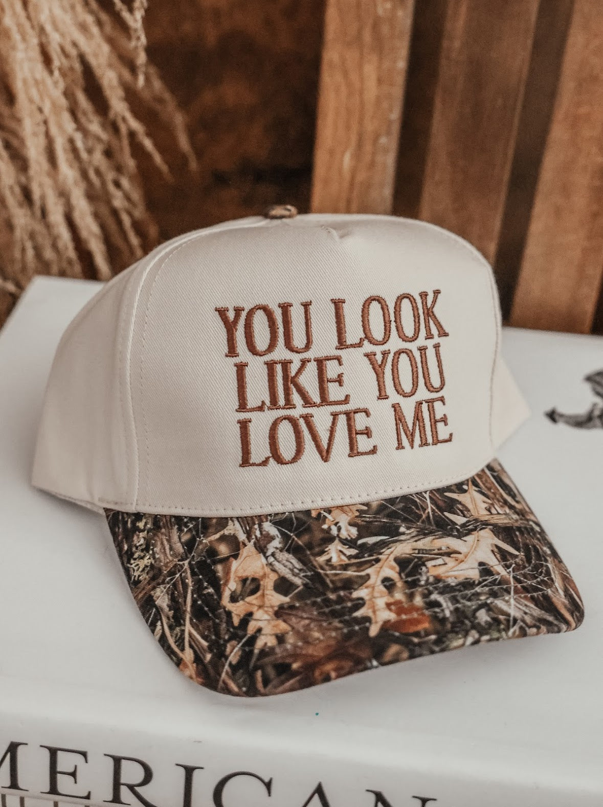 YOU LOOK LIKE YOU LOVE ME TRUCKER HAT